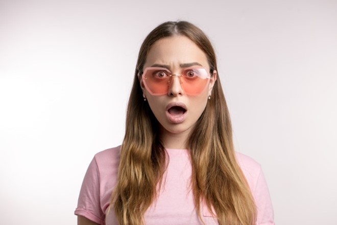 Woman with big pink glasses on. Refers to the fourth creative principle.